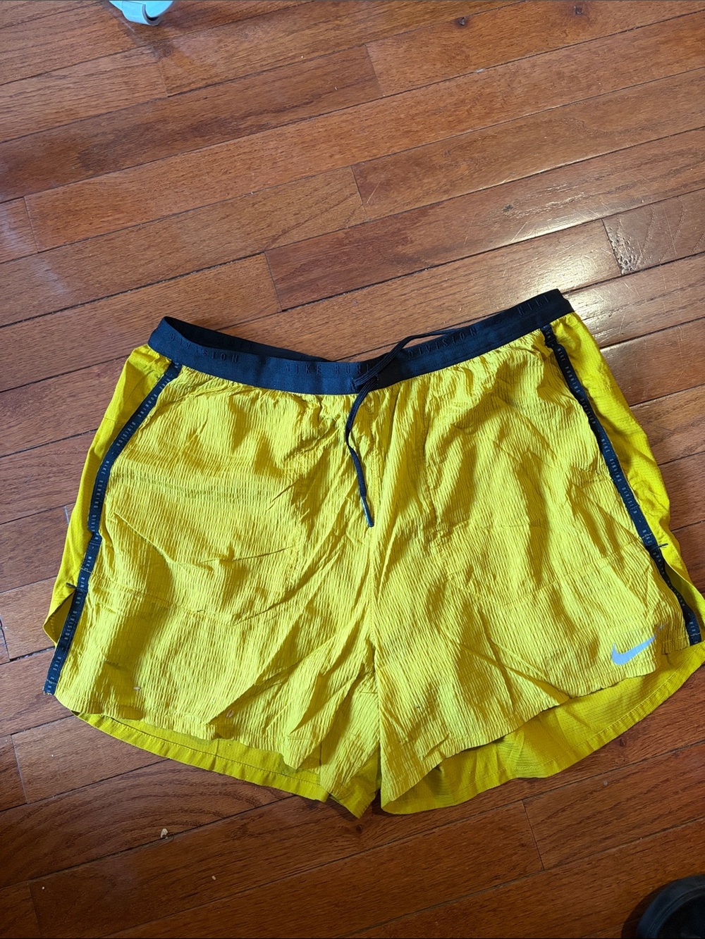 Nike Flex Stride Men’s Yellow Athletic Shorts with Black Waistband and Trim